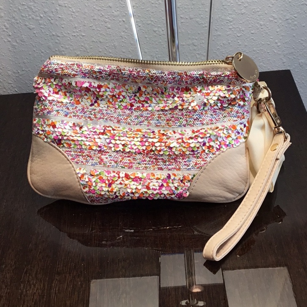 Charming leather and sequin wristlet